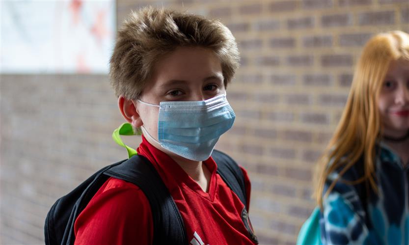 A student wearing a mask
